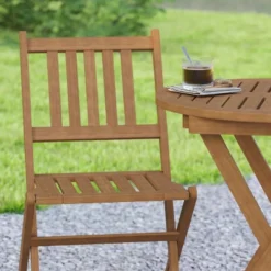 Emma And Oliver All-Weather Three Piece Solid Acacia Wood Patio Bistro Set With Two Folding Chairs And Table 14 Emma And Oliver All-Weather Three Piece Solid Acacia Wood Patio Bistro Set With Two Folding Chairs And Table -Emma And Oliver GUEST 778c8d4d ff3e 41d5 ad6f 8a67586100c0